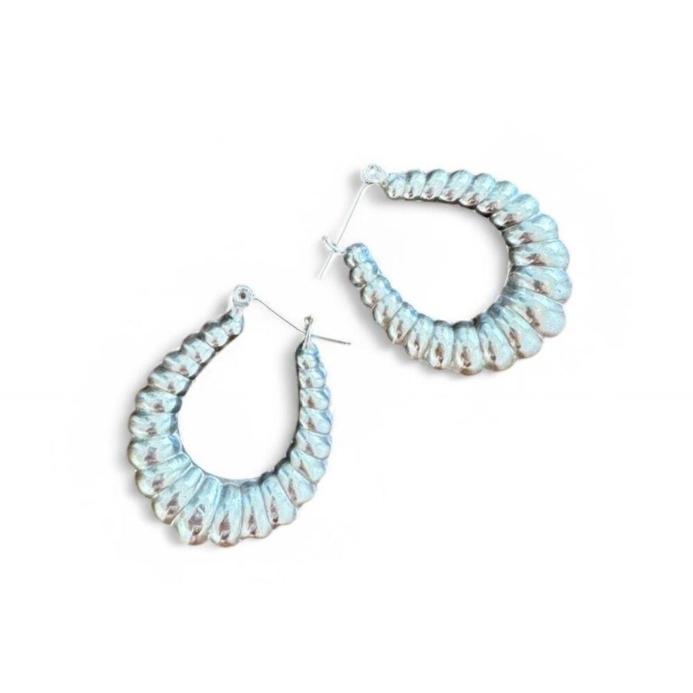 Silver hoop earrings pierced